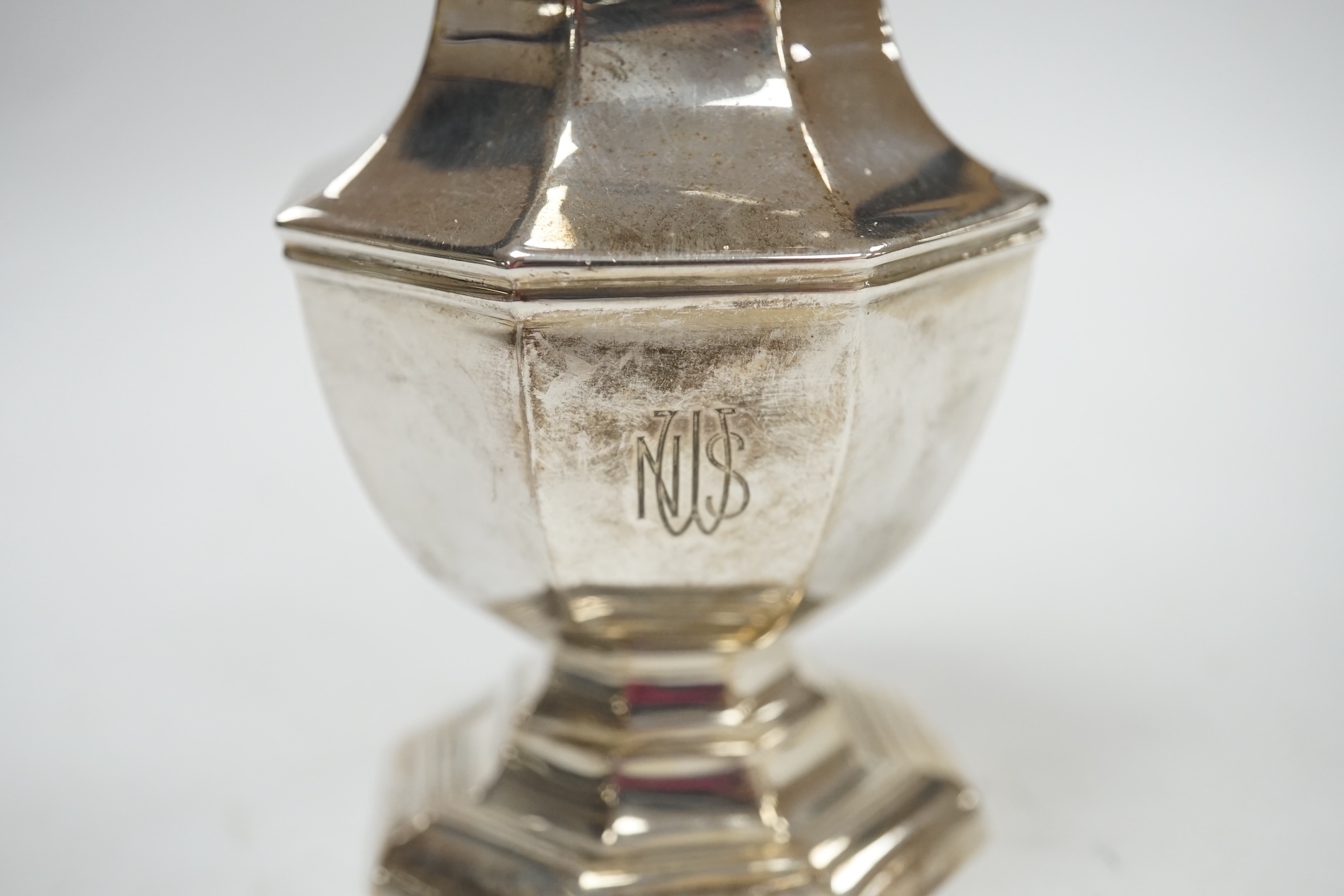 A George V silver octagonal sugar caster, Birmingham, 1918, 18.3cm, 5.5oz. Condition - poor to fair